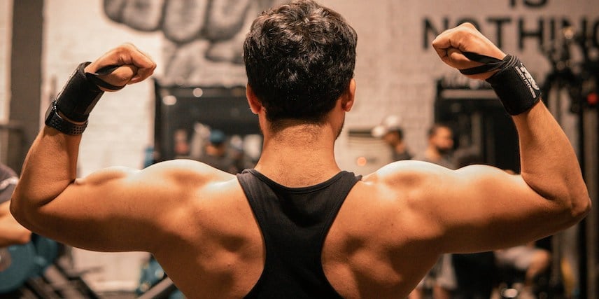 Flexing Man From Back