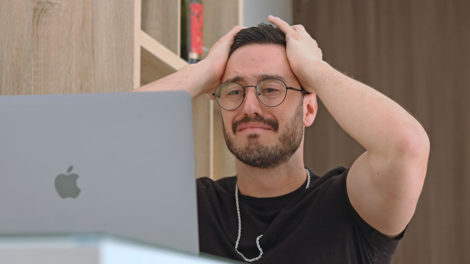 man looking perplexed at website code