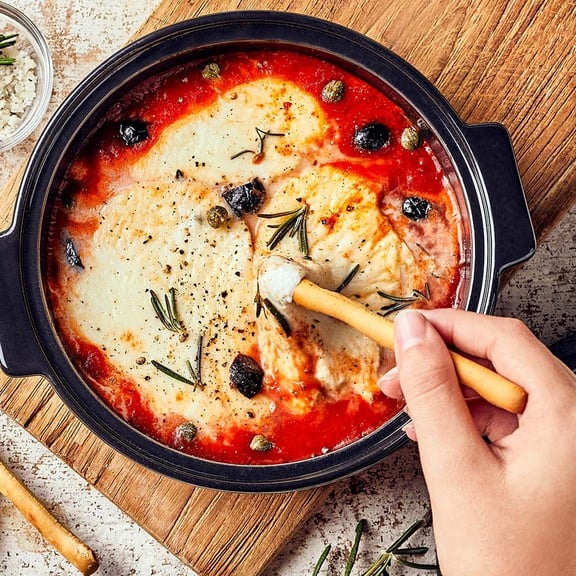 Person stirring food in a pot