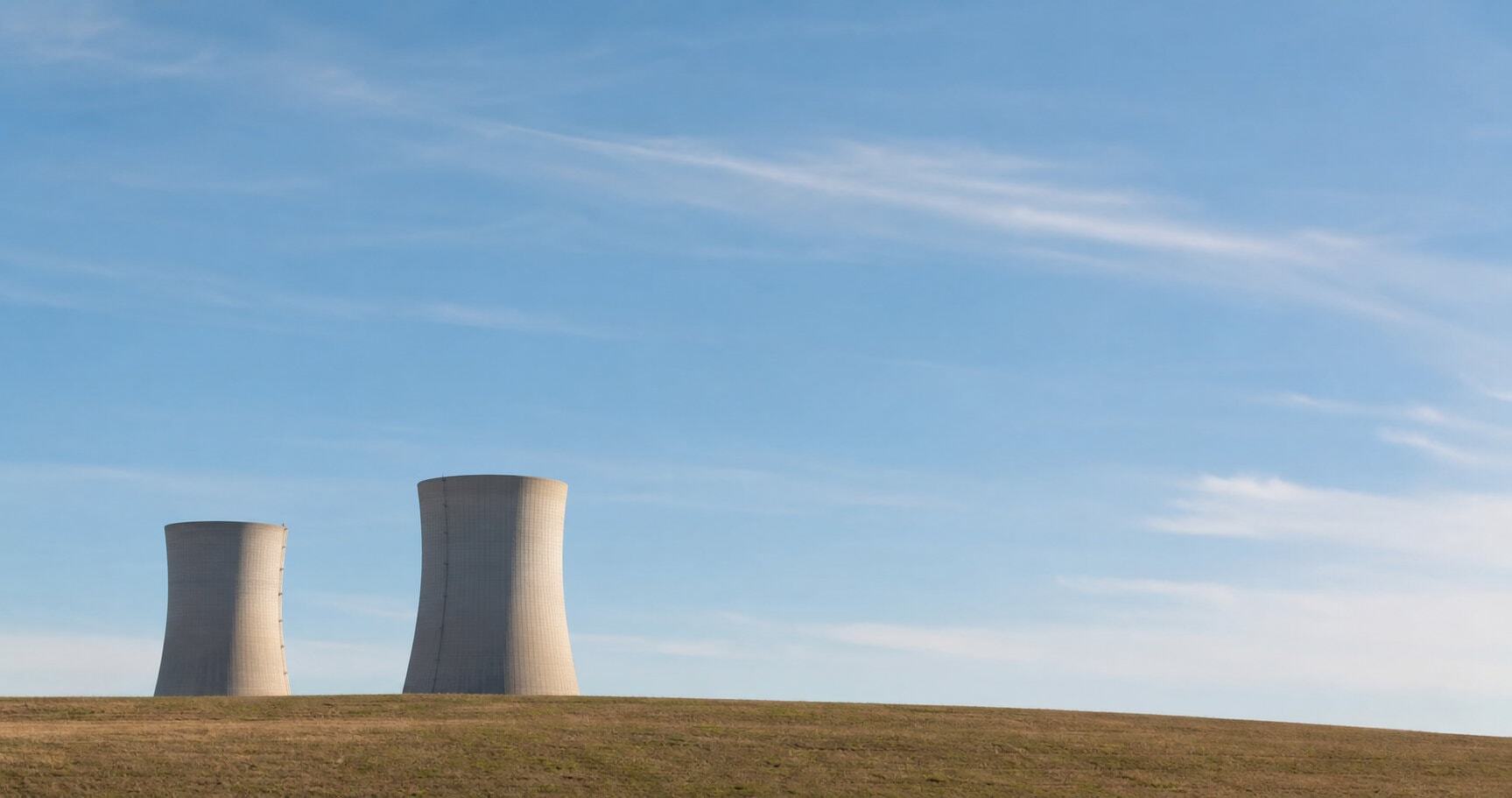 Nuclear plant chimneys against blue sky on a sunny day