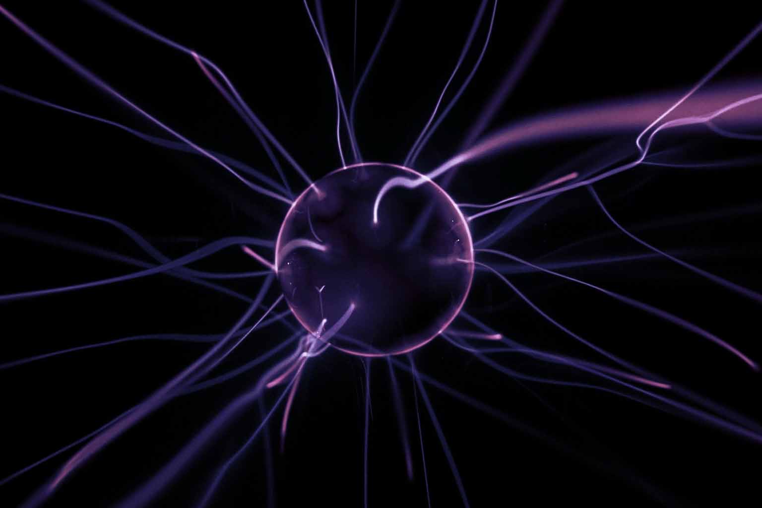 Close-up shot of a plasma sphere over a dark background