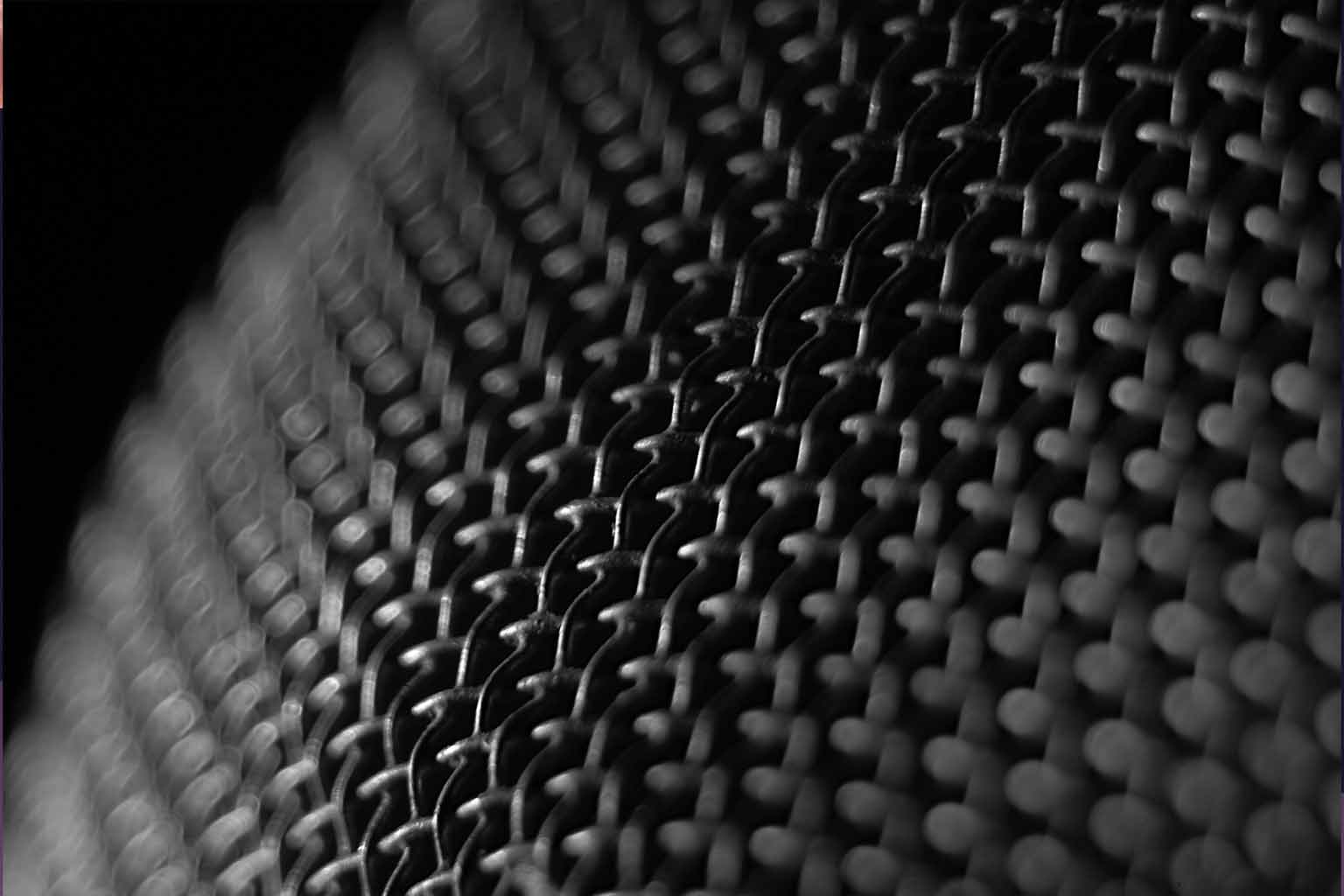 Close-up shot of a microphone's grille