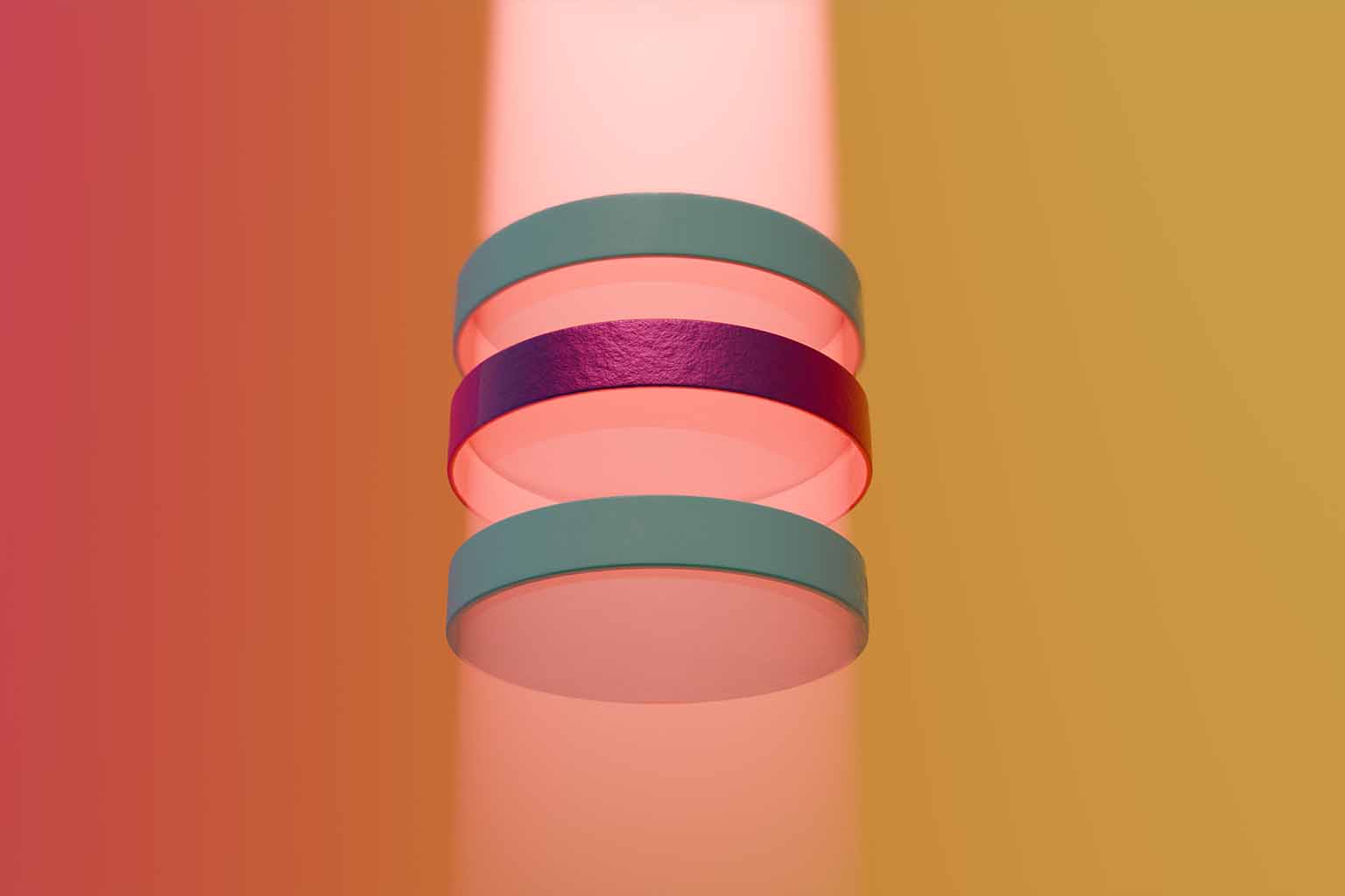 Three rings stacked over one another in alignment with a beam of light