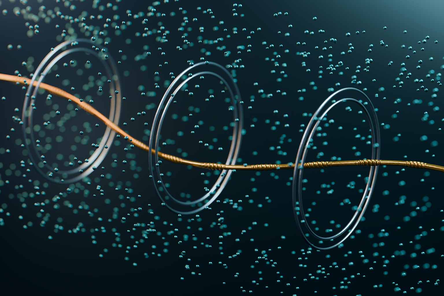 Three metallic rings rest suspended in a serene, deep-blue underwater landscape, bound together by a gleaming golden cable