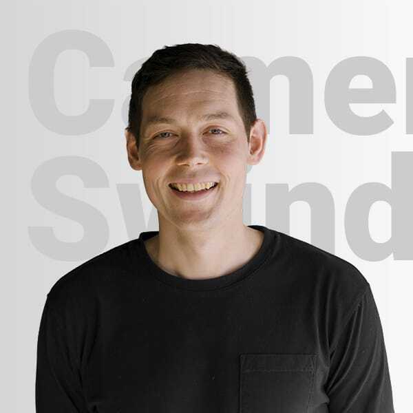 Cameron Swindells profile in a cafe Cameron Swindells profile in a cafe